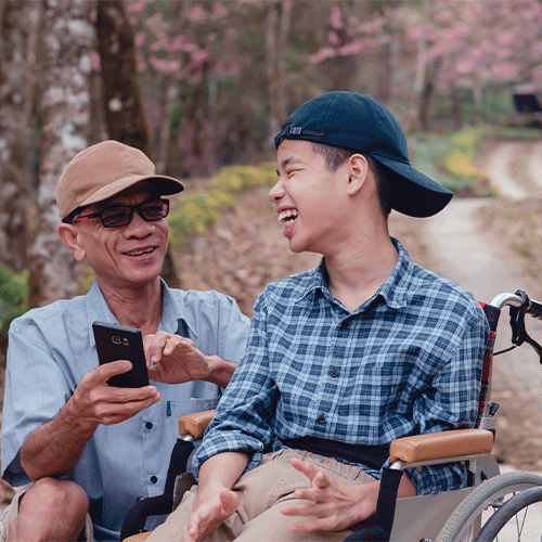 NDIS continence assessment Newcastle NSW — young person in wheelchair enjoying outdoor time with carer, supported by A1 Care Group telehealth services
